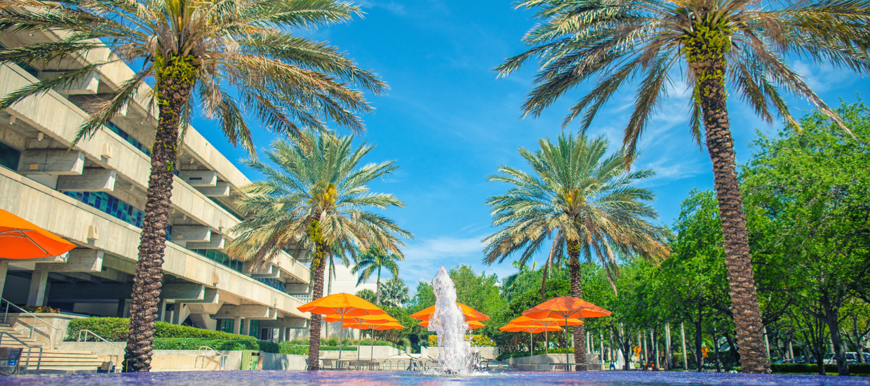 Cox fountain with palms and umbrellas